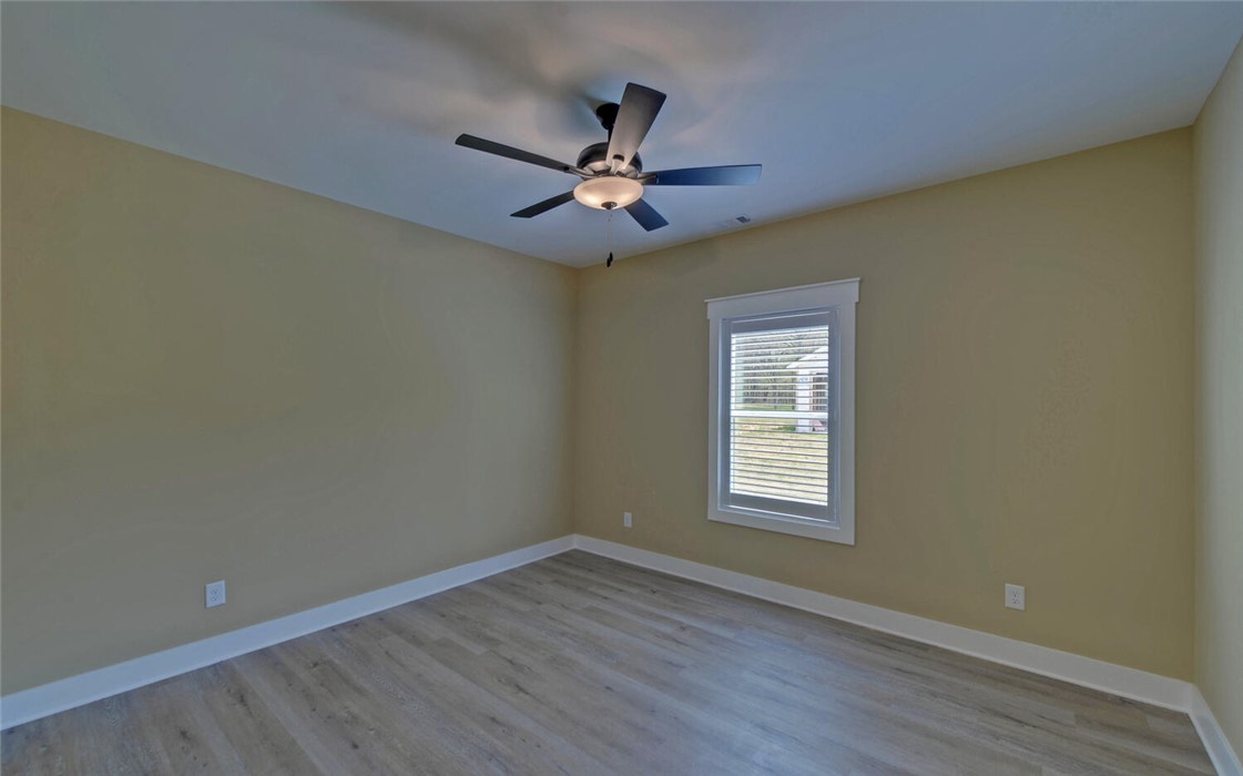 111 Topher Street Hartwell, GA 30643 - Photo 27 of 38 This spacious room features ample natural light and durable flooring, perfect for versatile living.