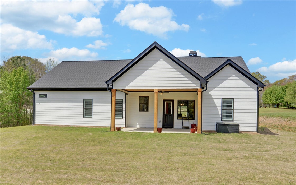 111 Topher Street Hartwell, GA 30643 - Photo 35 of 38 This newly constructed home boasts clean lines and a welcoming covered porch, perfect for outdoor enjoyment.