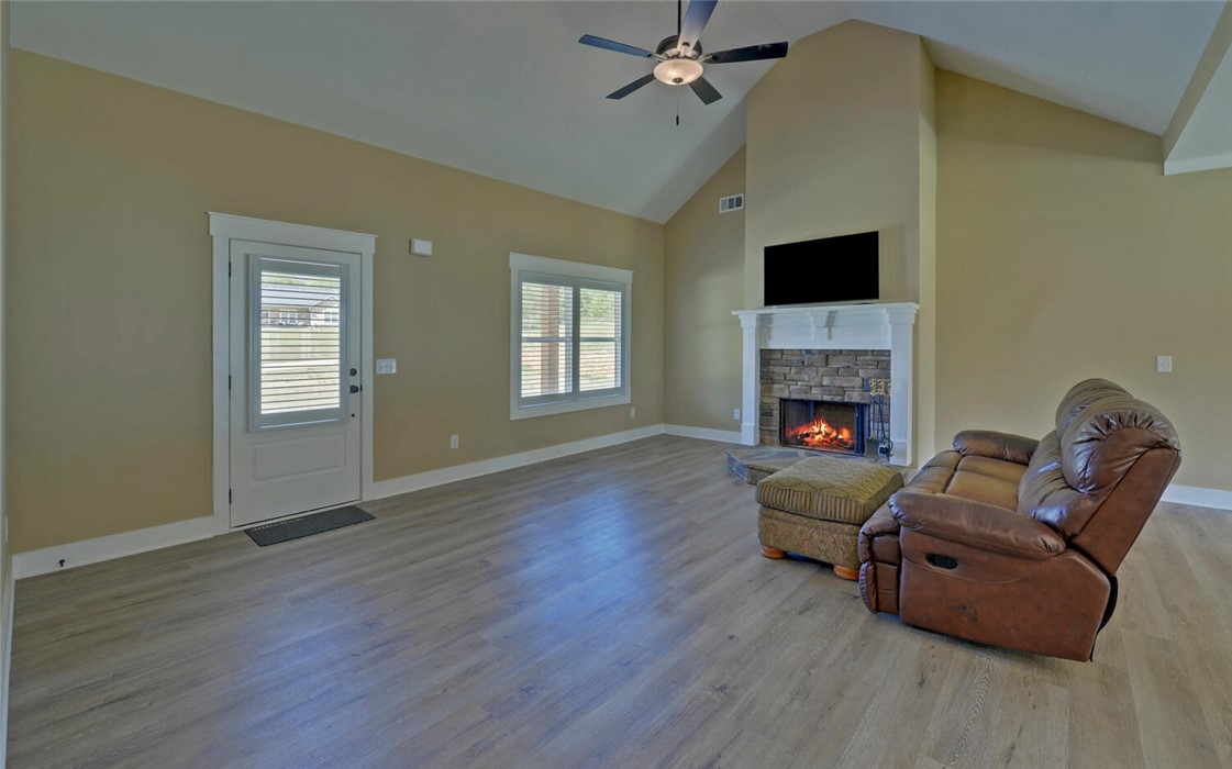 111 Topher Street Hartwell, GA 30643 - Photo 7 of 38 This inviting living space features vaulted ceilings and a warm, stone fireplace.