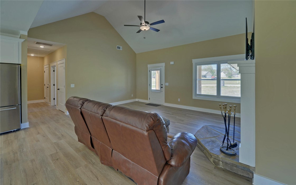 111 Topher Street Hartwell, GA 30643 - Photo 8 of 38 This bright living space features vaulted ceilings and light-toned flooring.