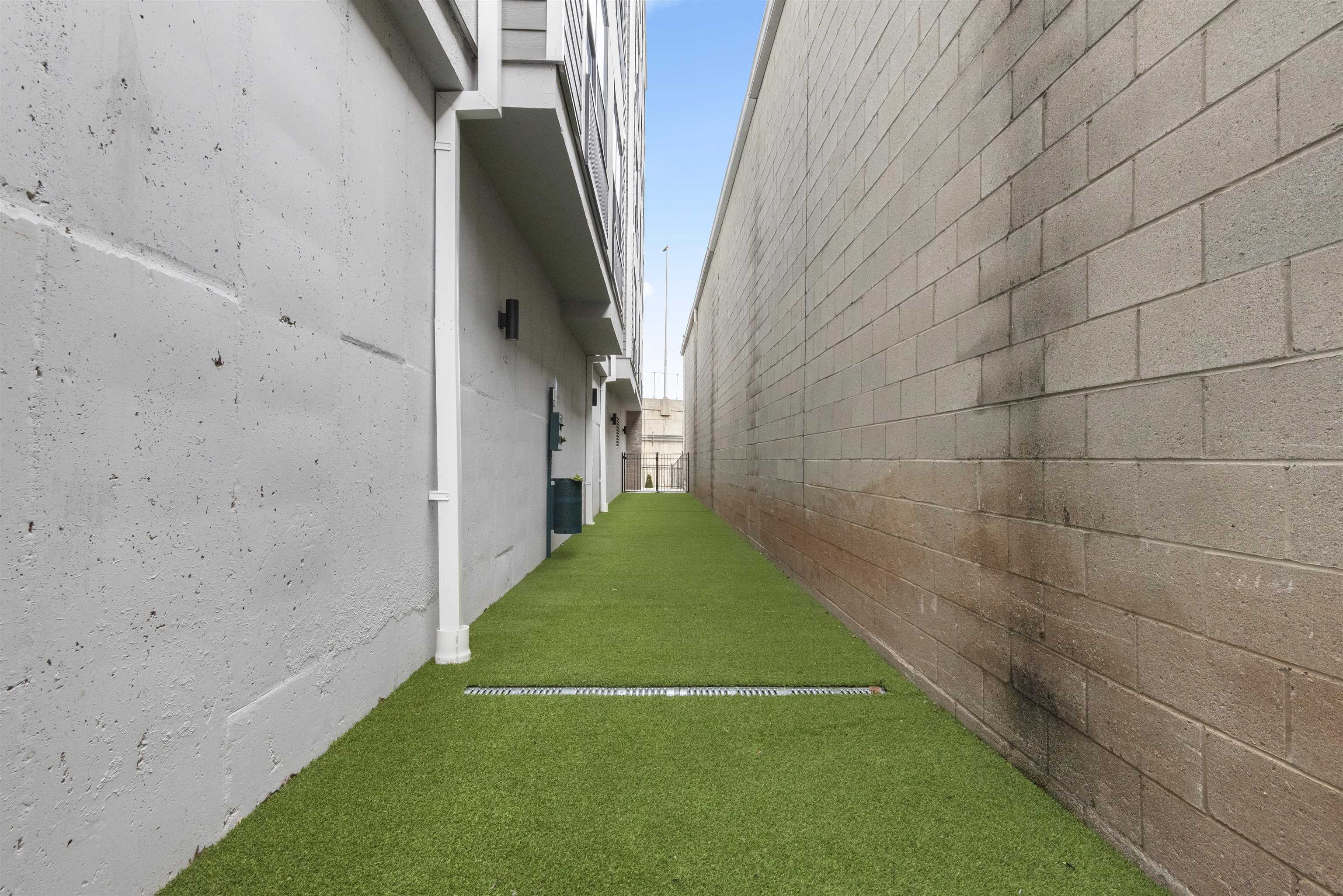 175 West 7th Street, Unit 502 Bayonne, NJ 07002 - Photo 26 of 33 a view of a pathway both side of a house