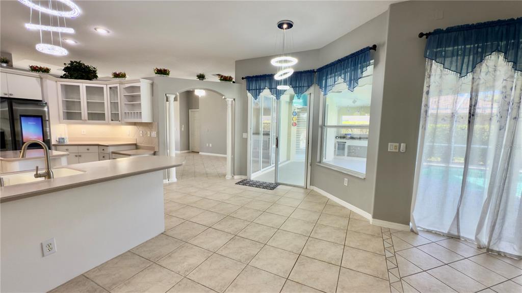 2049 Larissa Court Trinity, FL 34655 - Photo 22 of 61 a kitchen with stainless steel appliances granite countertop a refrigerator and a sink