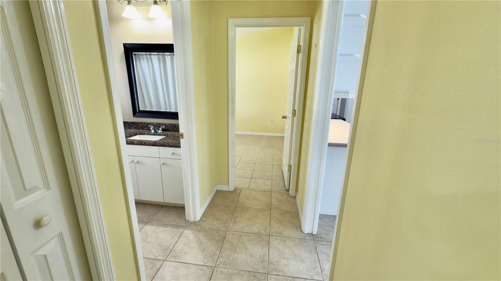 2049 Larissa Court Trinity, FL 34655 - Photo 29 of 61 a bathroom with a sink and mirror