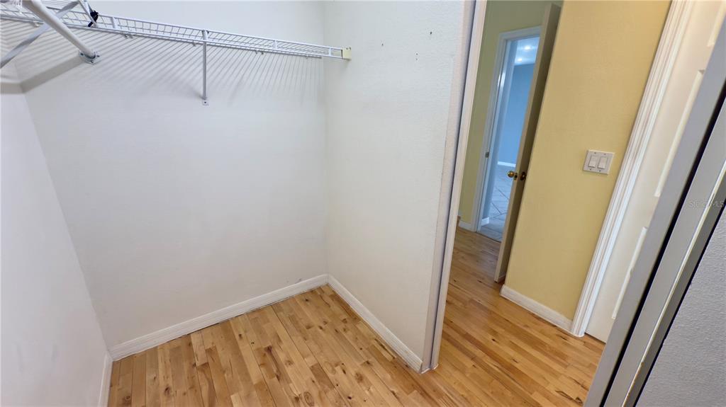 2049 Larissa Court Trinity, FL 34655 - Photo 38 of 61 a view of walk in closet with wooden floor