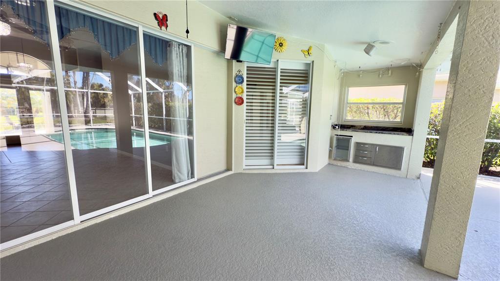 2049 Larissa Court Trinity, FL 34655 - Photo 42 of 61 a view of an empty room with a fireplace and a window