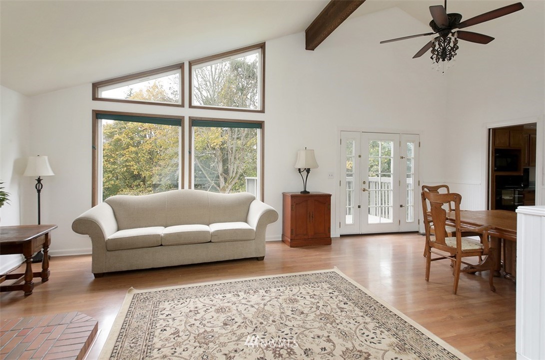 6793 Sills Road Clinton, WA 98236 - Photo 12 of 37 a living room with furniture and a large window