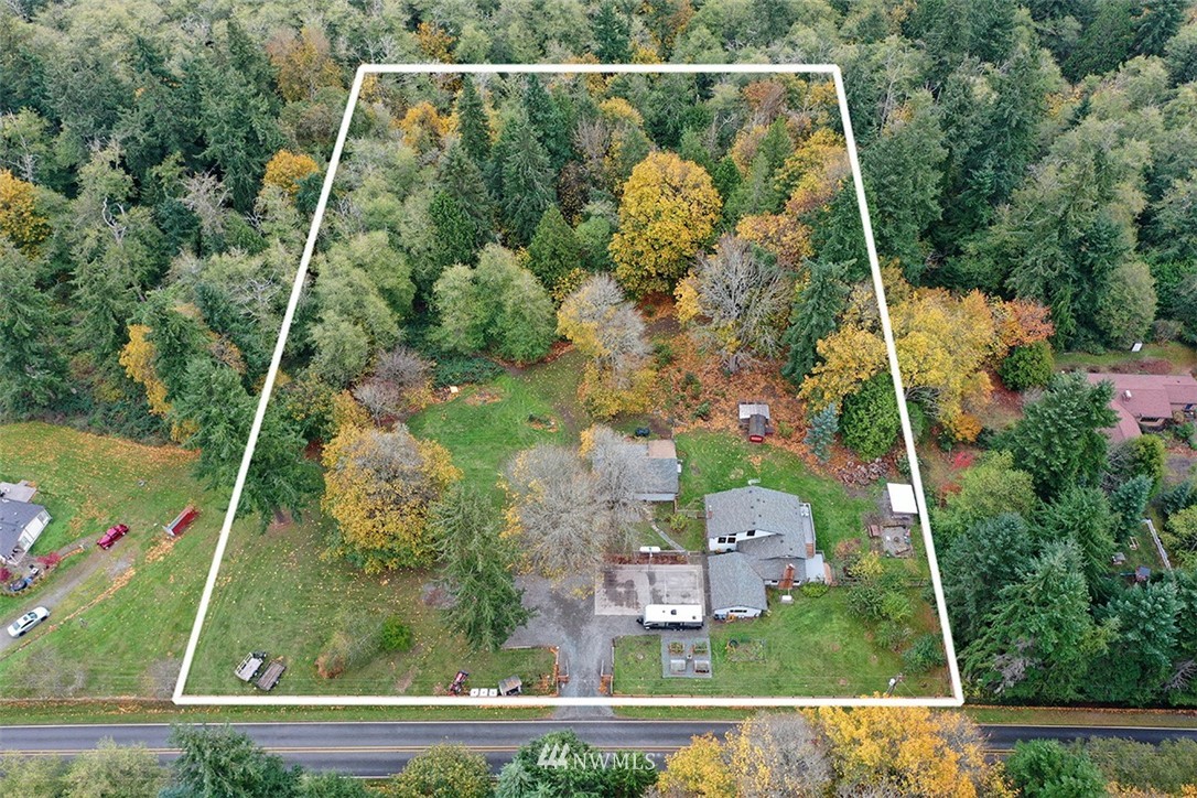 6793 Sills Road Clinton, WA 98236 - Photo 2 of 37 an aerial view of residential houses with outdoor space and trees