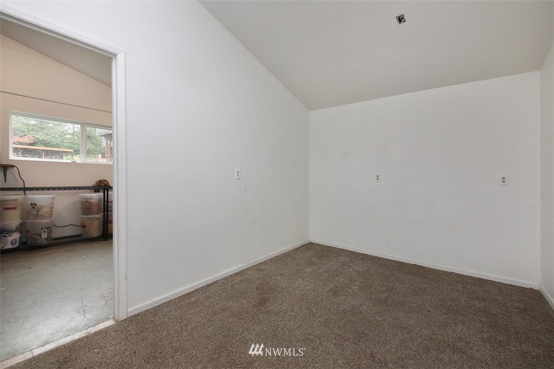 6793 Sills Road Clinton, WA 98236 - Photo 25 of 37 a view of hallway with a window