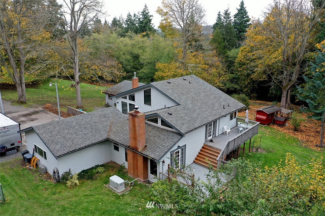 6793 Sills Road Clinton, WA 98236 - Photo 27 of 37 an aerial view of a house with swimming pool and garden
