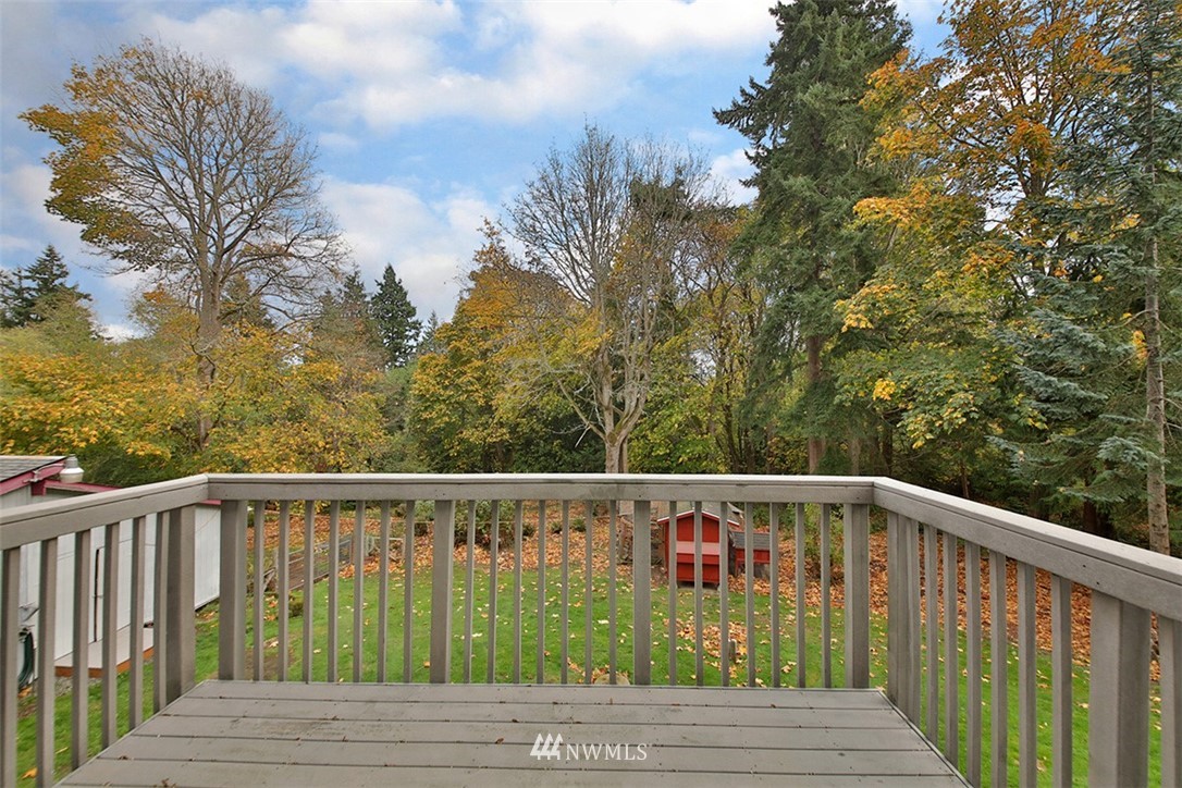 6793 Sills Road Clinton, WA 98236 - Photo 30 of 37 a view of wooden deck and forest