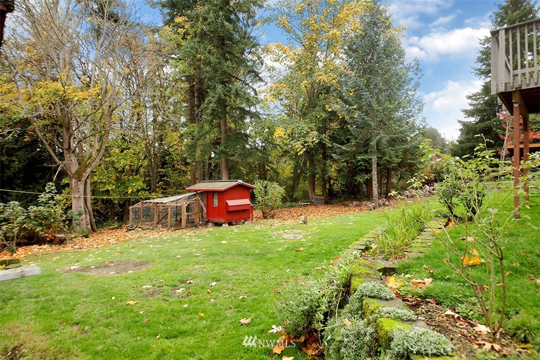 6793 Sills Road Clinton, WA 98236 - Photo 33 of 37 a view of backyard with swimming pool and trees