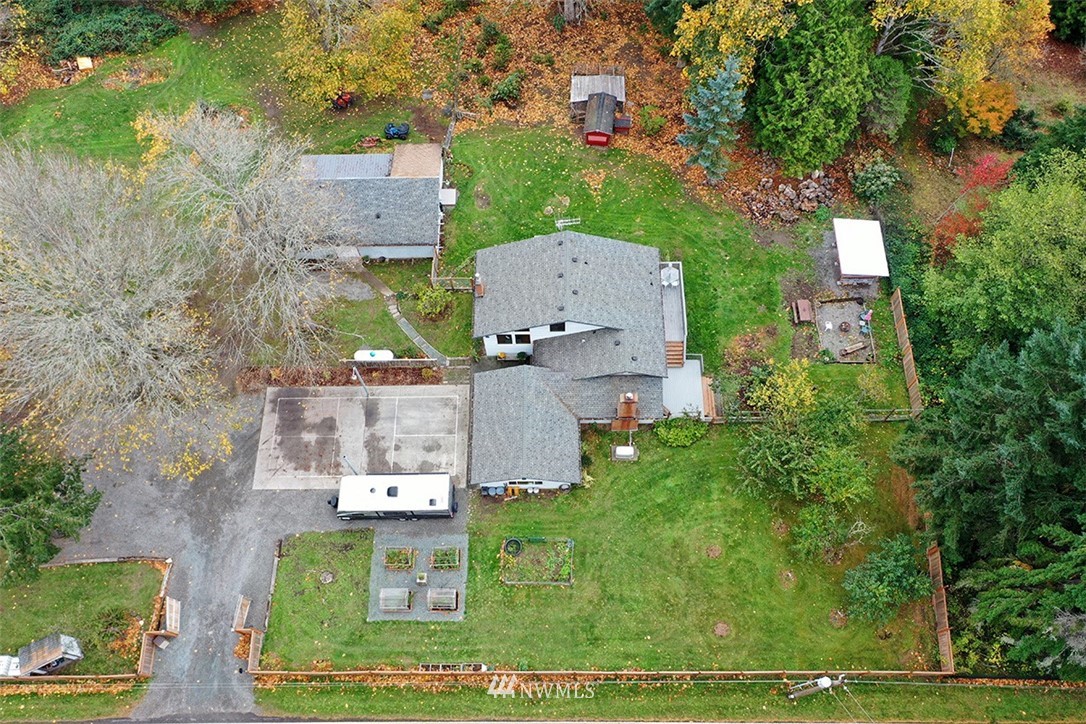 6793 Sills Road Clinton, WA 98236 - Photo 34 of 37 an aerial view of a house with a yard