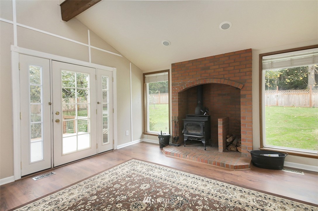 6793 Sills Road Clinton, WA 98236 - Photo 6 of 37 a view of livingroom with furniture and a fireplace