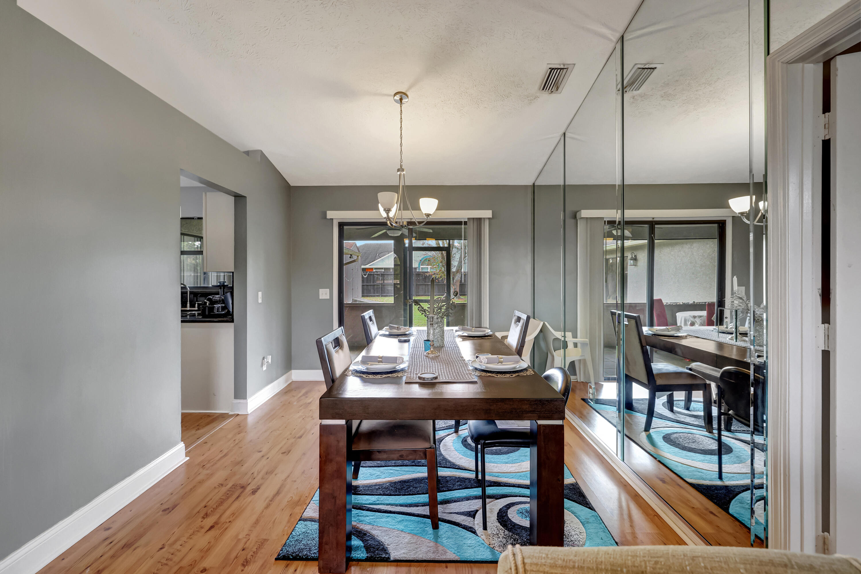 284 Southwest N Quick Circle Port St. Lucie, FL 34953 - Photo 5 of 18 a view of a dining room with furniture window and wooden floor