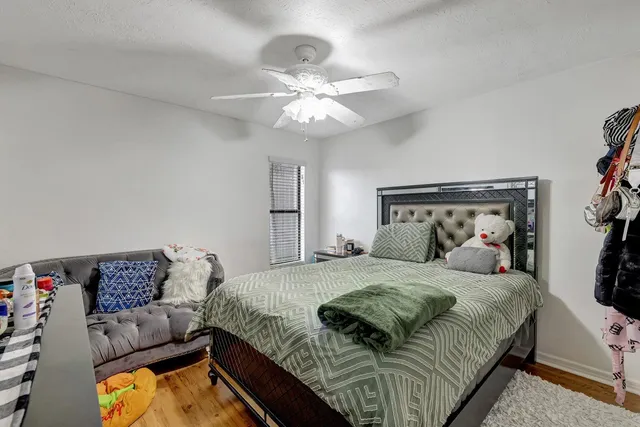 a bedroom with bed and window