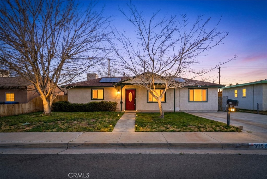 309 North Fairview Street Ridgecrest, CA 93555 - Photo 1 of 30 a front view of a house with a yard and garage