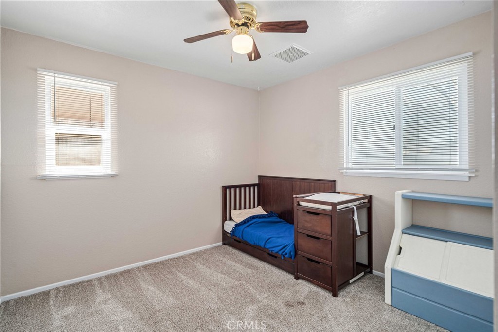 309 North Fairview Street Ridgecrest, CA 93555 - Photo 21 of 30 a living room with furniture and a window