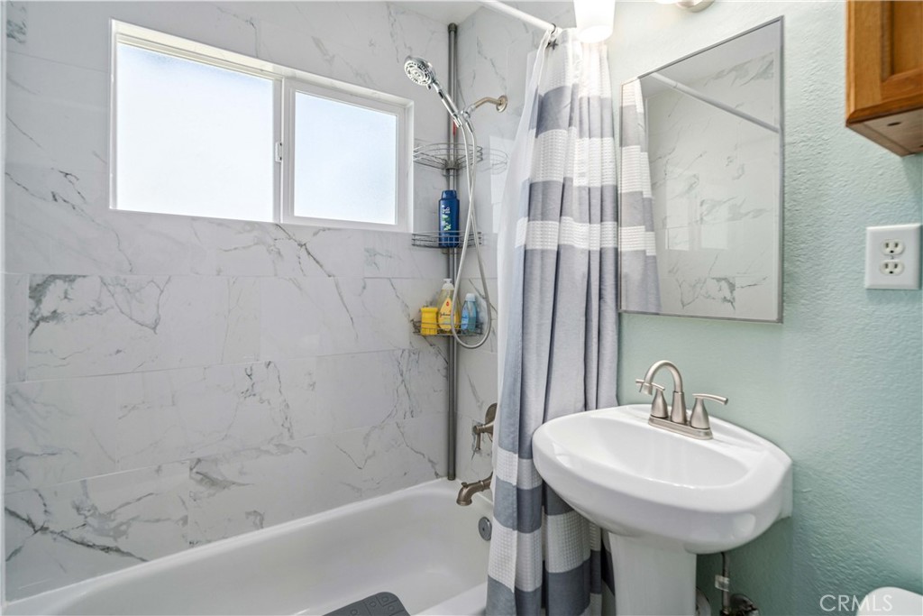 309 North Fairview Street Ridgecrest, CA 93555 - Photo 22 of 30 a bathroom with a sink a toilet and shower