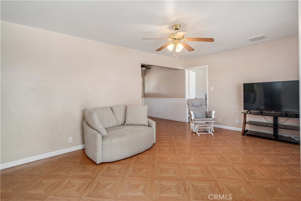 309 North Fairview Street Ridgecrest, CA 93555 - Photo 5 of 30 a living room with furniture and a flat screen tv
