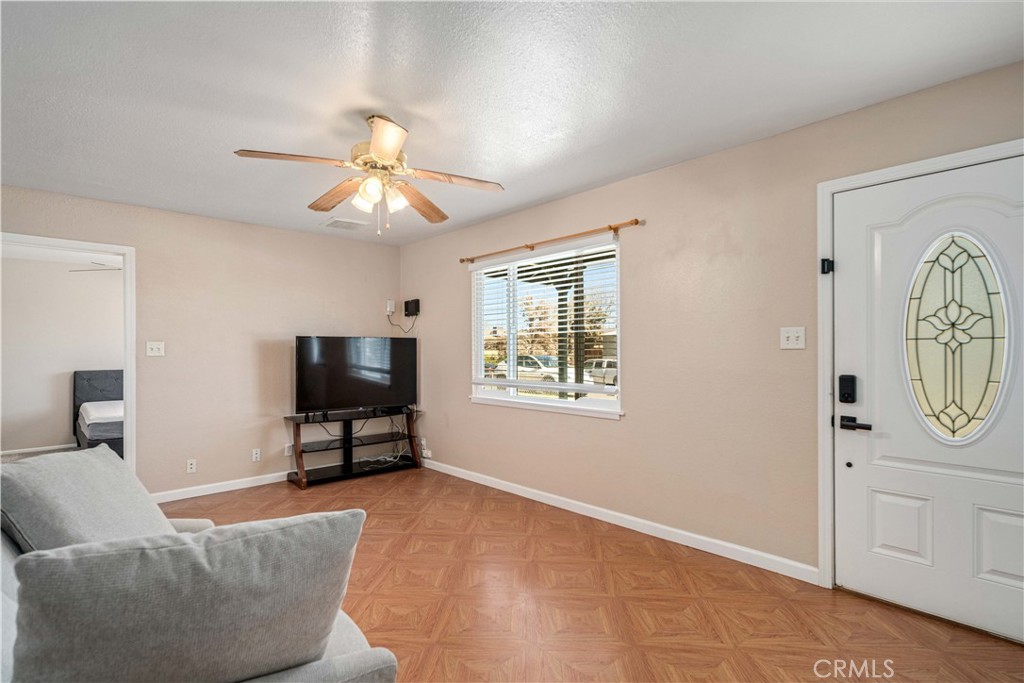 309 North Fairview Street Ridgecrest, CA 93555 - Photo 6 of 30 a living room with furniture and a flat screen tv