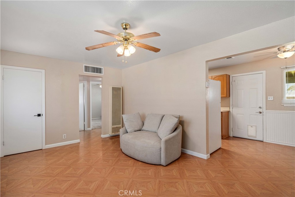 309 North Fairview Street Ridgecrest, CA 93555 - Photo 8 of 30 a living room with furniture and a chandelier fan