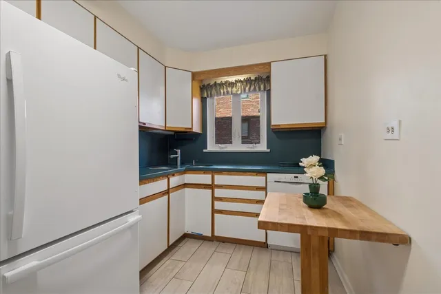 a kitchen with a sink and a window