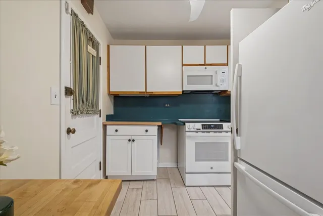 a view of a room with gym equipment and window