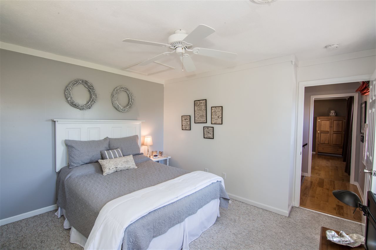 9139 Centerville Road Bridgewater, VA 22812 - Photo 29 of 50 a bedroom with a bed and a chandelier