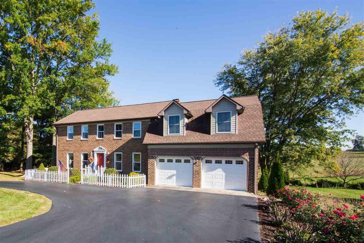 9139 Centerville Road Bridgewater, VA 22812 - Photo 3 of 50 a front view of a house with a garden