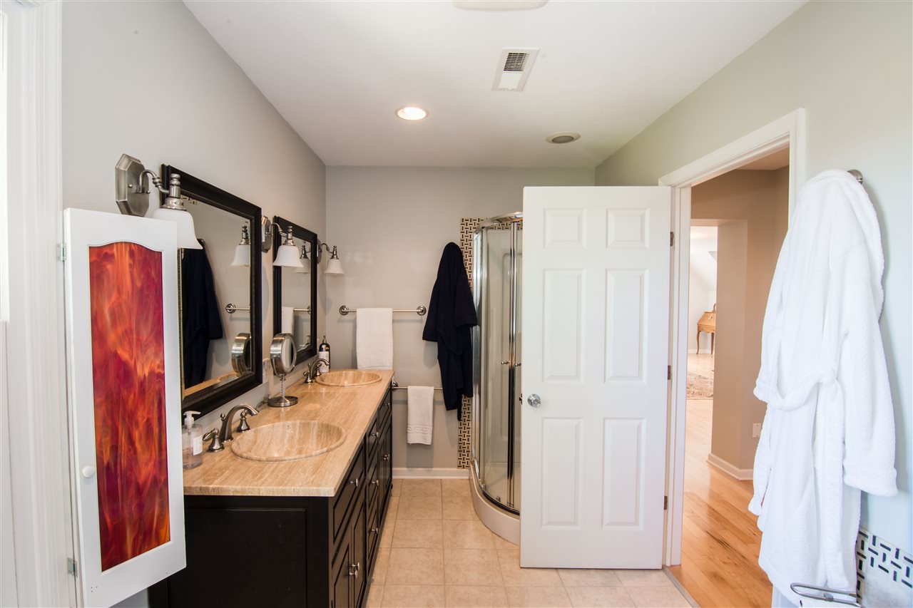 9139 Centerville Road Bridgewater, VA 22812 - Photo 36 of 50 a bathroom with a double vanity sink and mirror