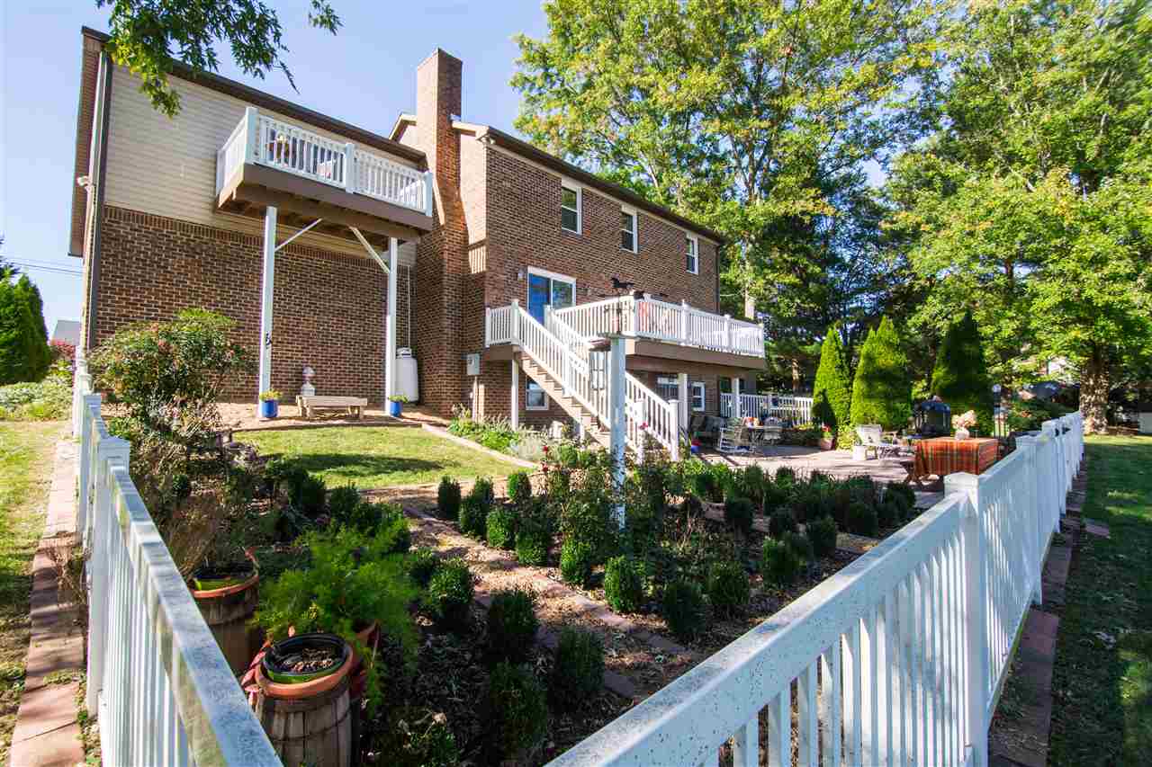 9139 Centerville Road Bridgewater, VA 22812 - Photo 8 of 50 a view of a house with brick walls and flower plants