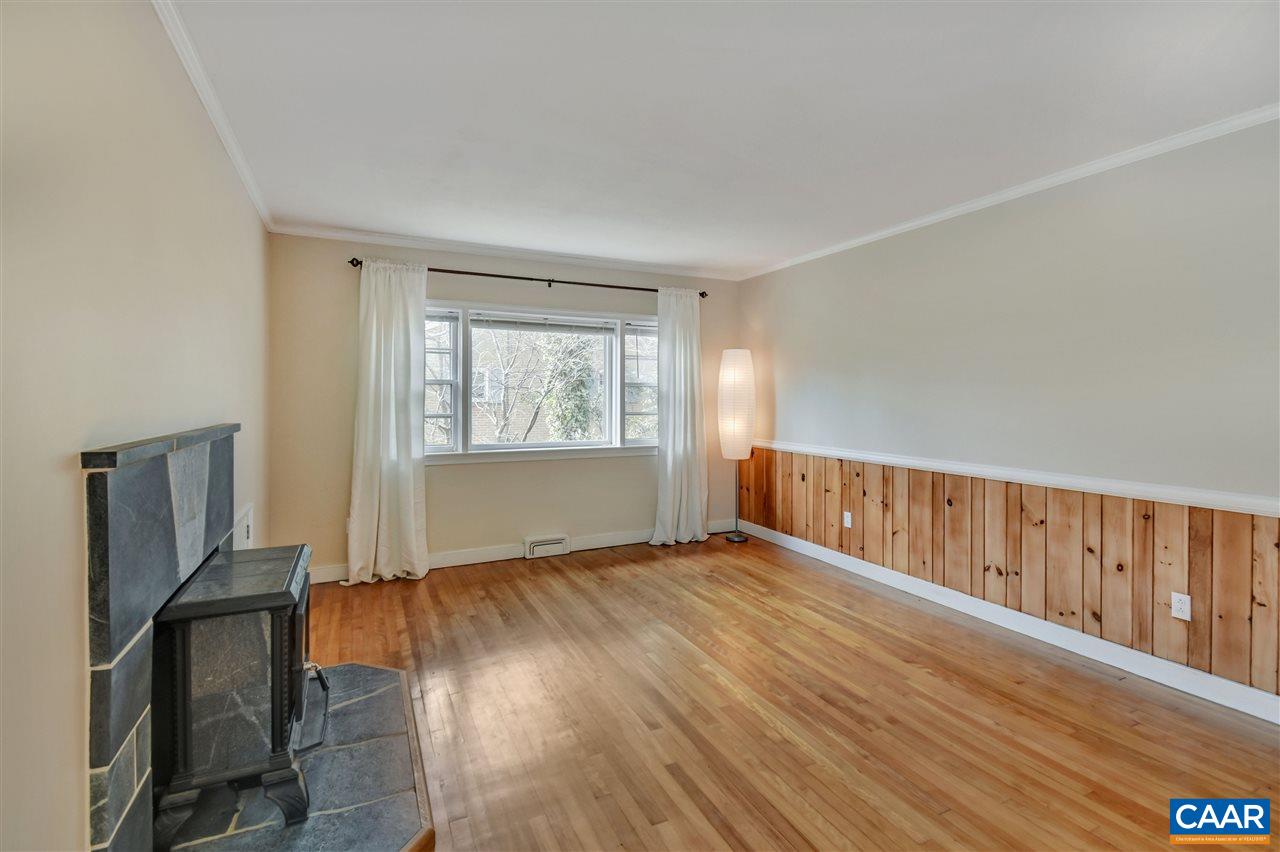 442 Rio Road West Charlottesville, VA 22901 - Photo 11 of 48 a view of an empty room with wooden floor and a window