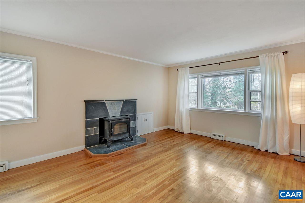 442 Rio Road West Charlottesville, VA 22901 - Photo 12 of 48 a view of empty room with wooden floor and fireplace