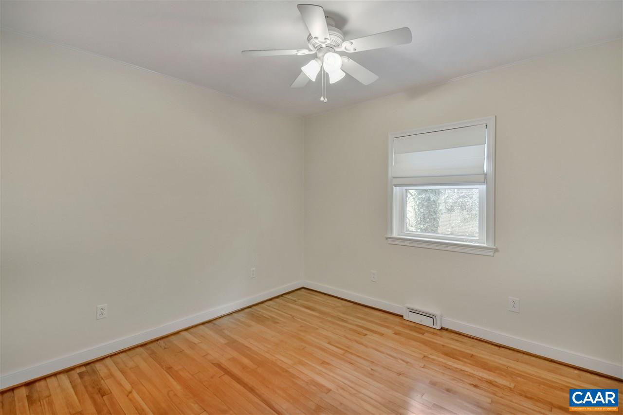 442 Rio Road West Charlottesville, VA 22901 - Photo 23 of 48 wooden floor in an empty room with a window