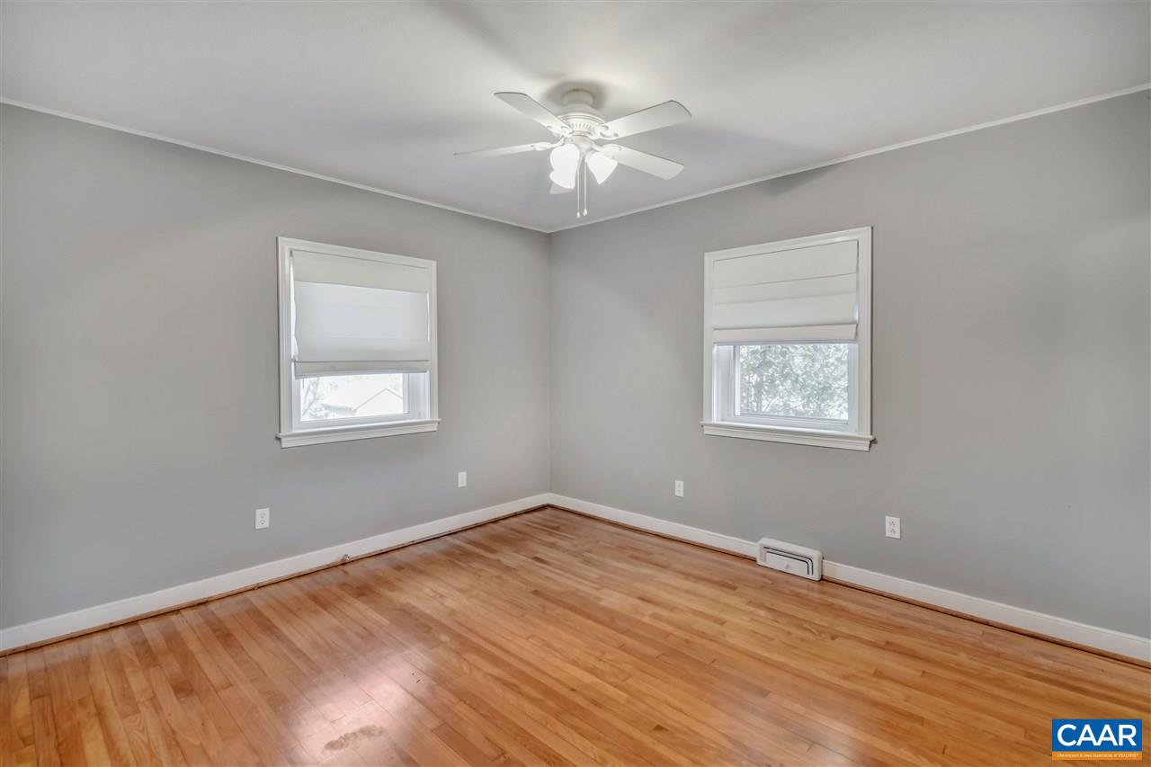 442 Rio Road West Charlottesville, VA 22901 - Photo 25 of 48 a view of a room with a window and a ceiling fan