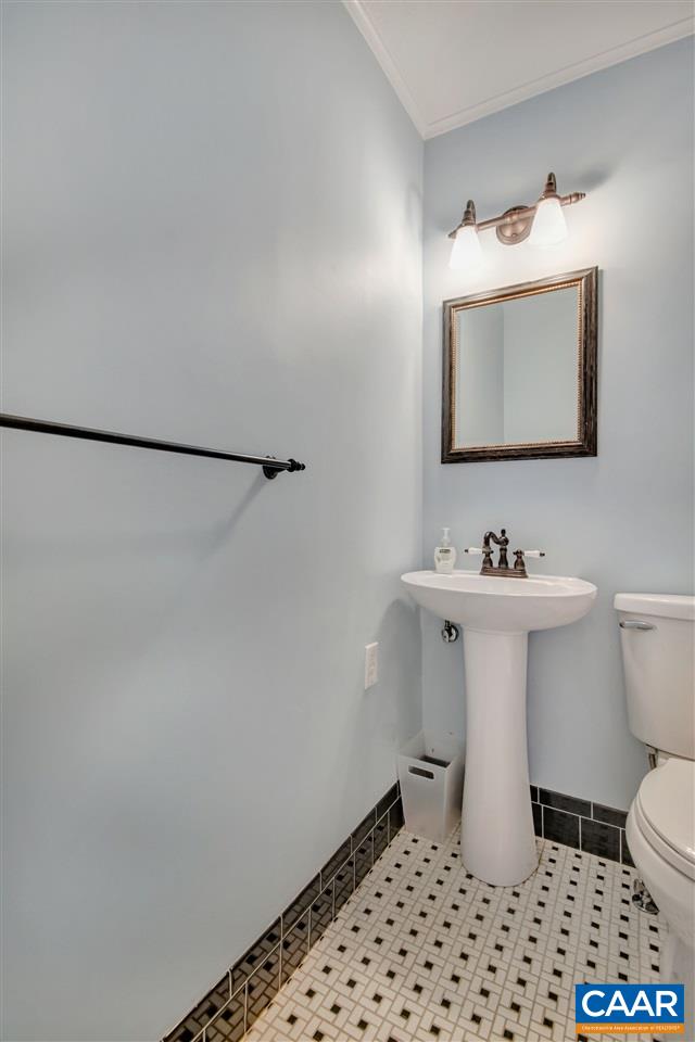 442 Rio Road West Charlottesville, VA 22901 - Photo 27 of 48 a bathroom with a sink toilet and mirror