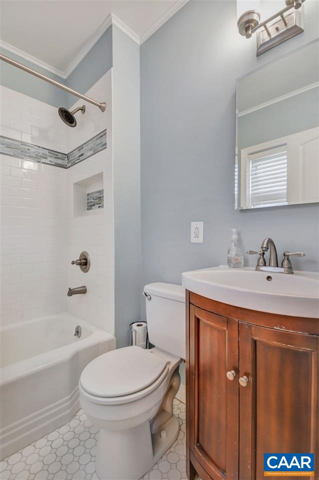 442 Rio Road West Charlottesville, VA 22901 - Photo 30 of 48 a bathroom with a granite countertop sink toilet and shower