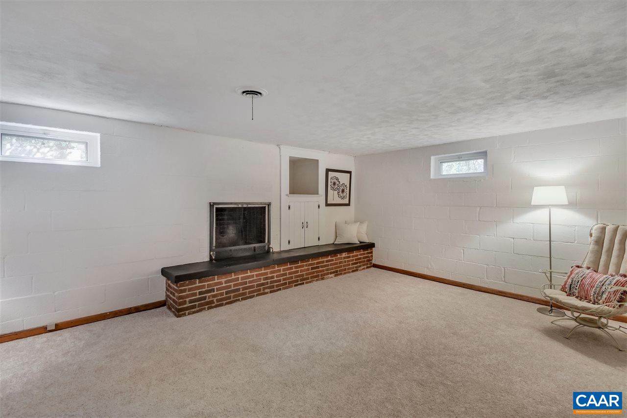 442 Rio Road West Charlottesville, VA 22901 - Photo 32 of 48 a view of an empty room with a fireplace