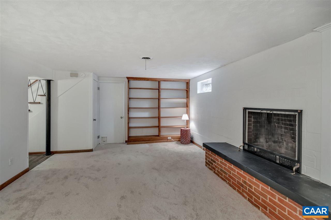442 Rio Road West Charlottesville, VA 22901 - Photo 34 of 48 a view of an empty room with a fireplace