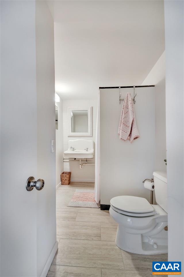 442 Rio Road West Charlottesville, VA 22901 - Photo 36 of 48 a bathroom with a toilet sink and shower