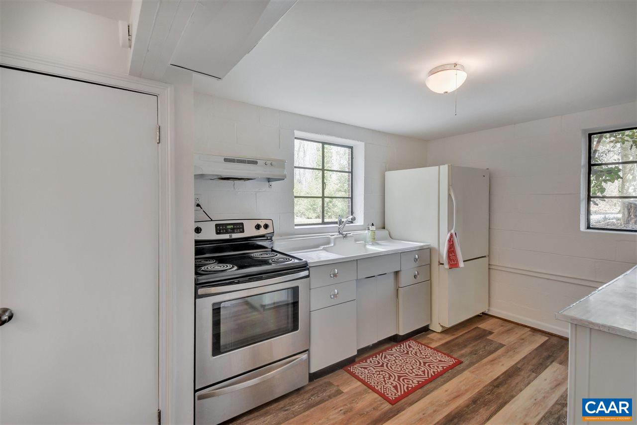 442 Rio Road West Charlottesville, VA 22901 - Photo 41 of 48 a kitchen with a stove and a refrigerator