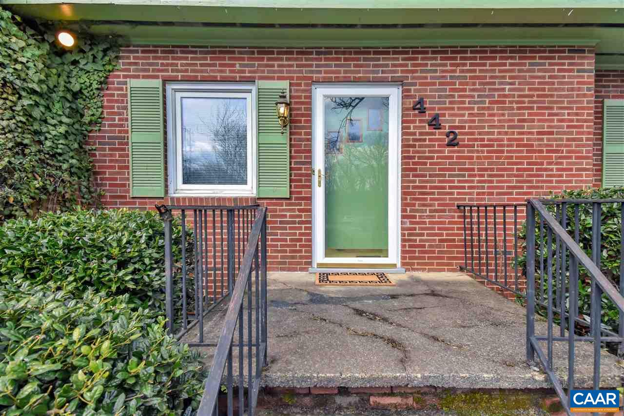 442 Rio Road West Charlottesville, VA 22901 - Photo 7 of 48 a front view of a house with a garden
