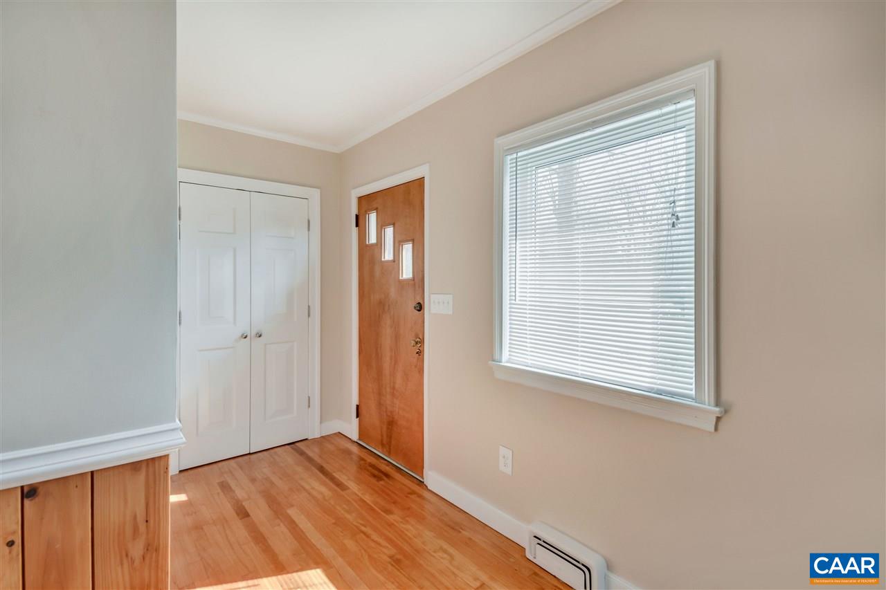 442 Rio Road West Charlottesville, VA 22901 - Photo 10 of 48 a view of an empty room with wooden floor and a window