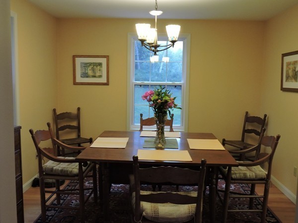 279 Main Road Westhampton, MA 01027 - Photo 17 of 22 a view of a dining room with furniture and chandelier
