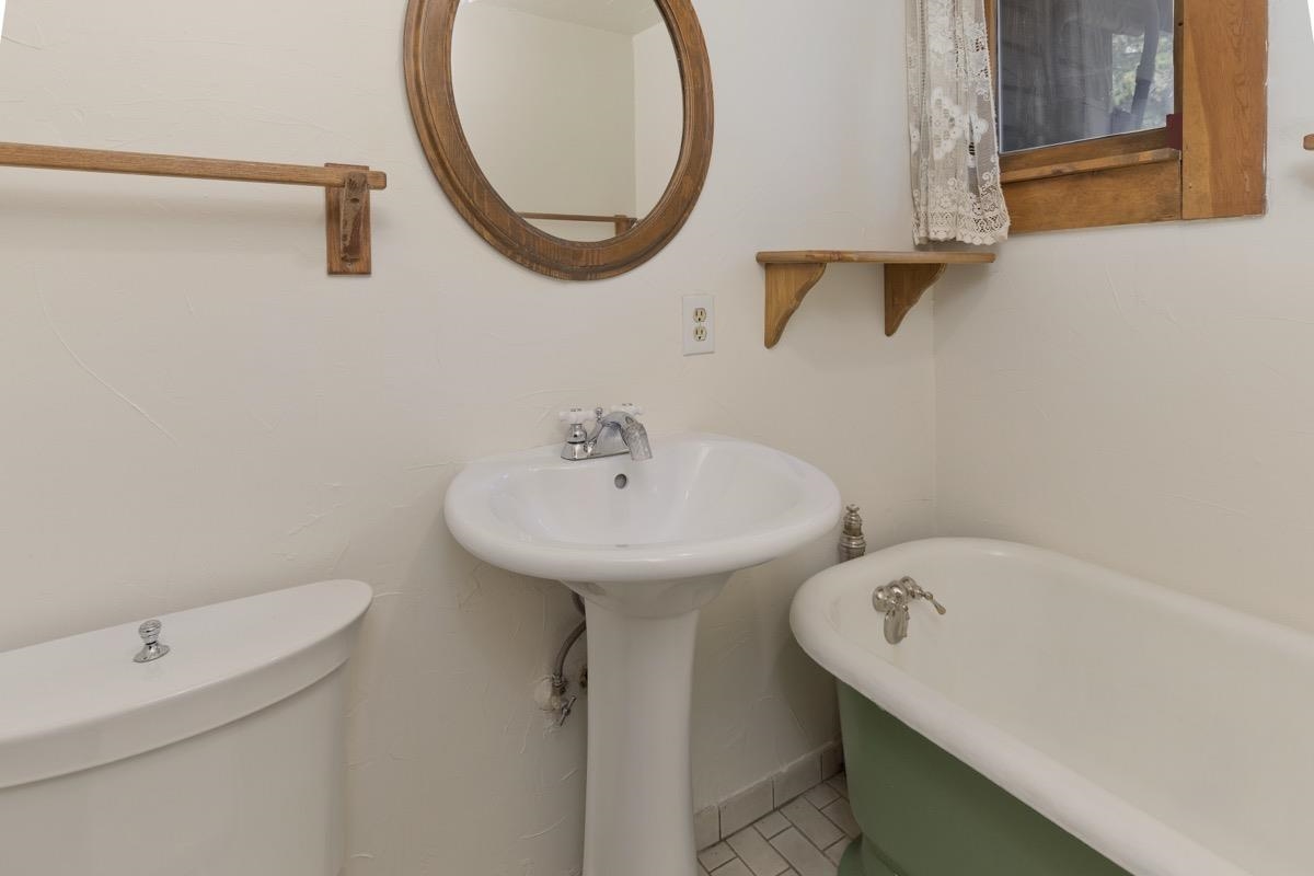 2030 Old Mammoth Road Mammoth Lakes, CA 93546 - Photo 26 of 46 a bathroom with a sink and a mirror
