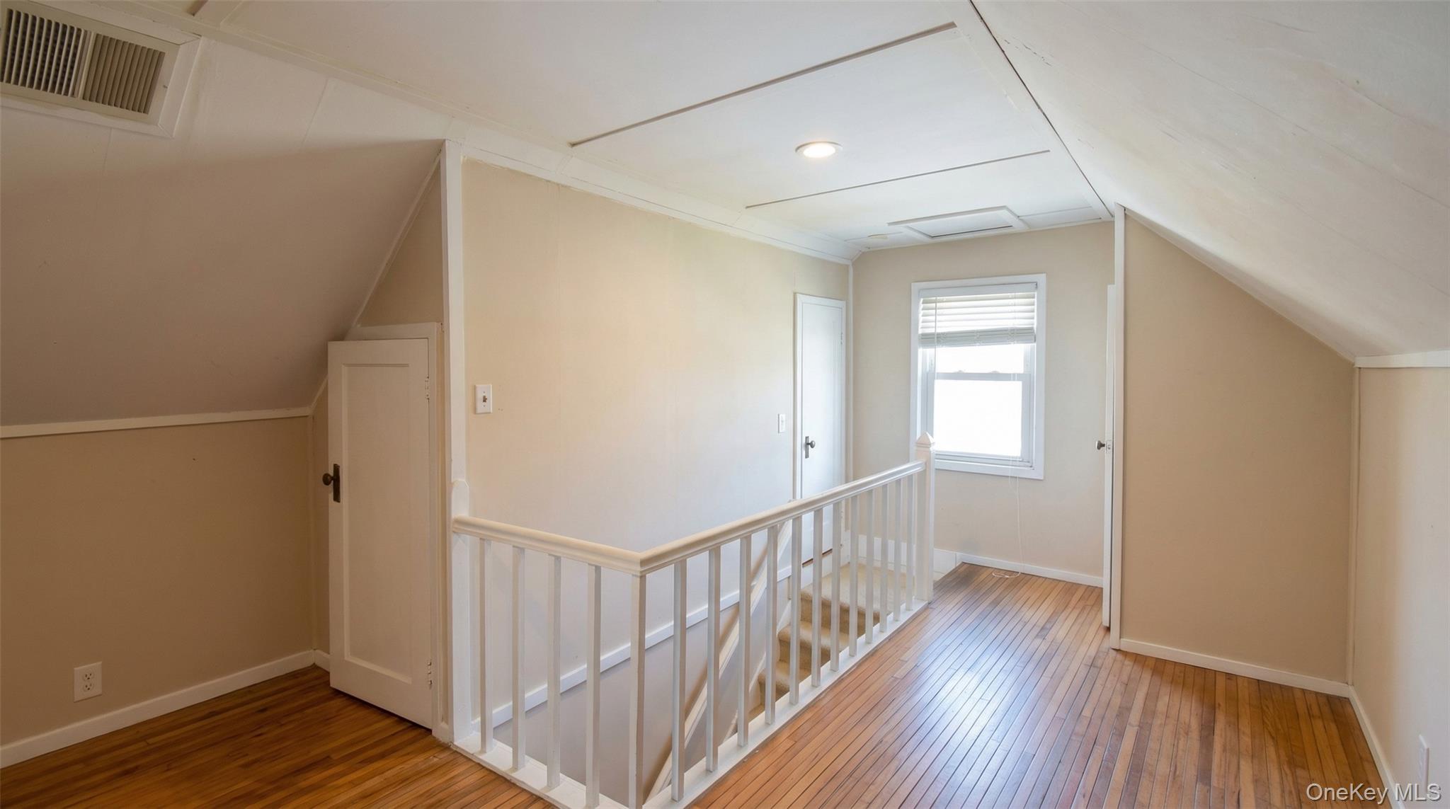 6 Sullivan Road Farmingdale, NY 11735 - Photo 14 of 21 a view of a hallway with wooden floor and entryway