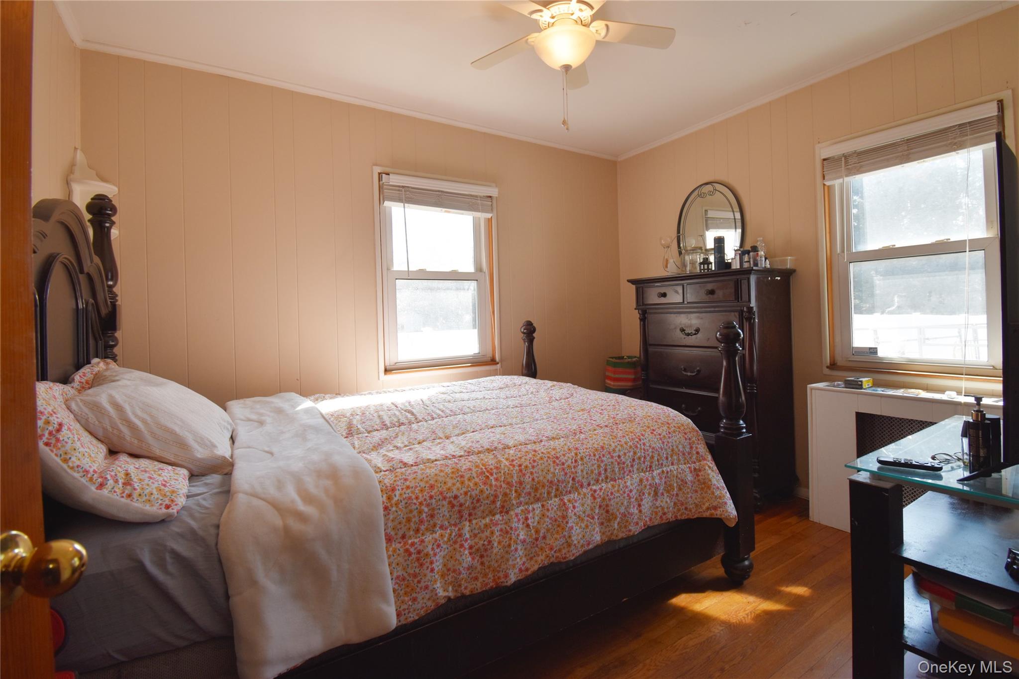 6 Sullivan Road Farmingdale, NY 11735 - Photo 15 of 21 a bedroom with a bed and a chandelier