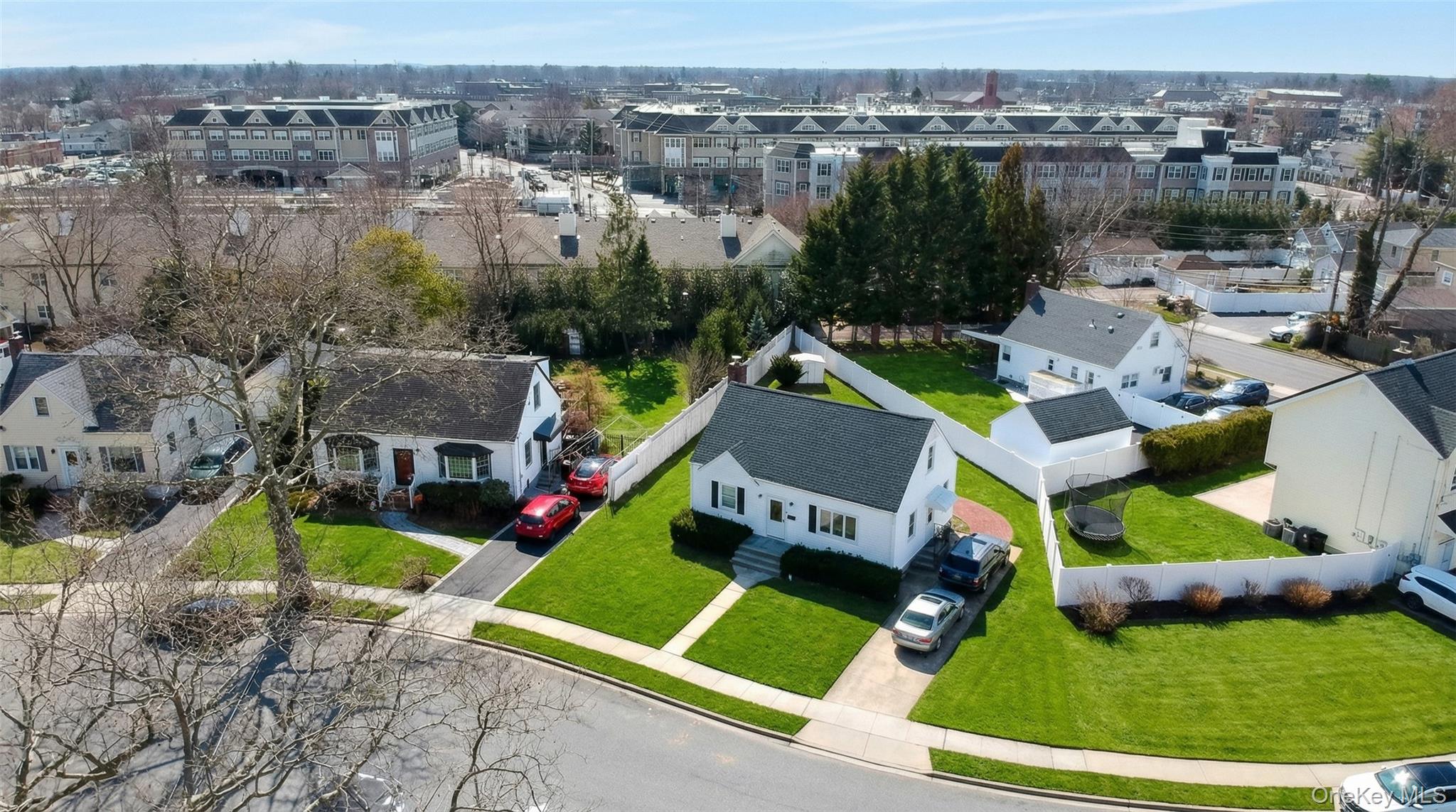 6 Sullivan Road Farmingdale, NY 11735 - Photo 2 of 21 an aerial view of a house with a garden and swimming pool