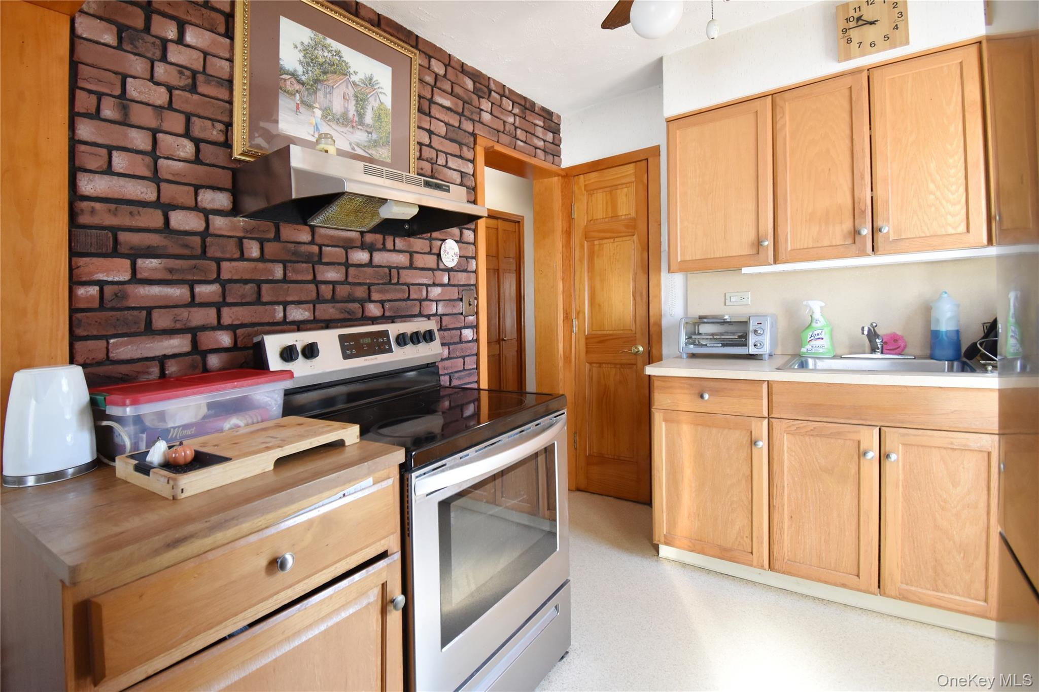 6 Sullivan Road Farmingdale, NY 11735 - Photo 6 of 21 a kitchen with stainless steel appliances a stove and a refrigerator
