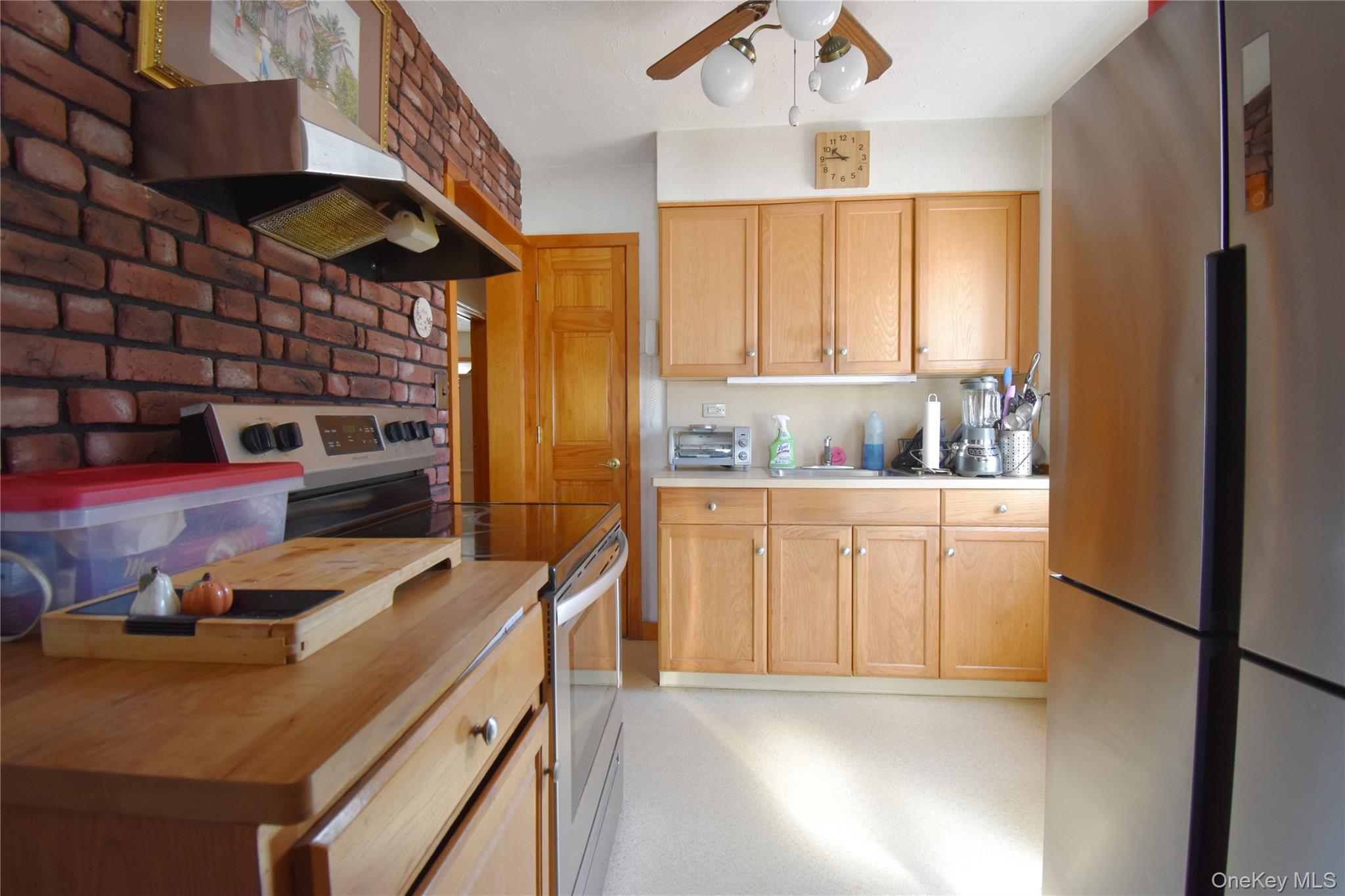 6 Sullivan Road Farmingdale, NY 11735 - Photo 7 of 21 a kitchen with a refrigerator and a stove